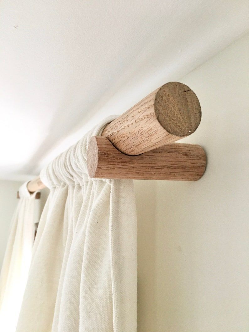 A wooden curtain rod