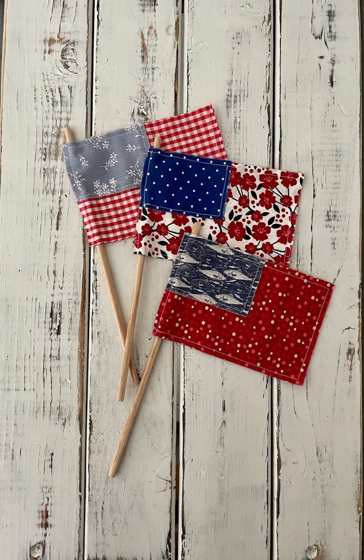 Three hand-sewn hand flags