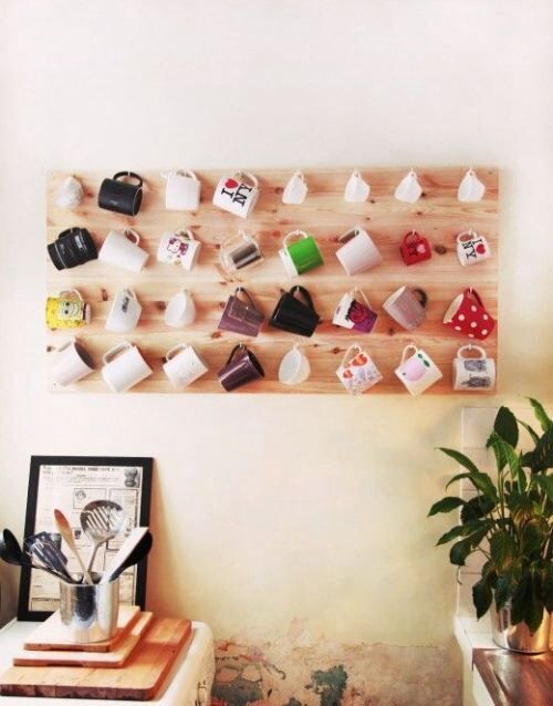 Peg board with mugs hanging