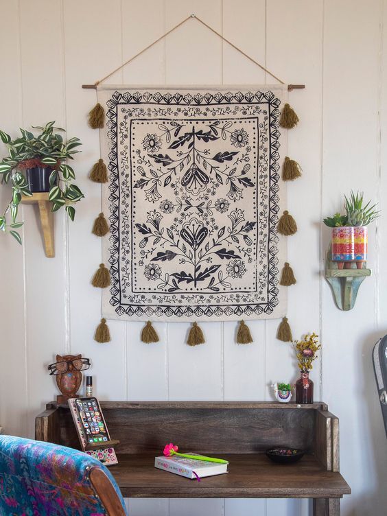 A small tapestry hanging on a wall